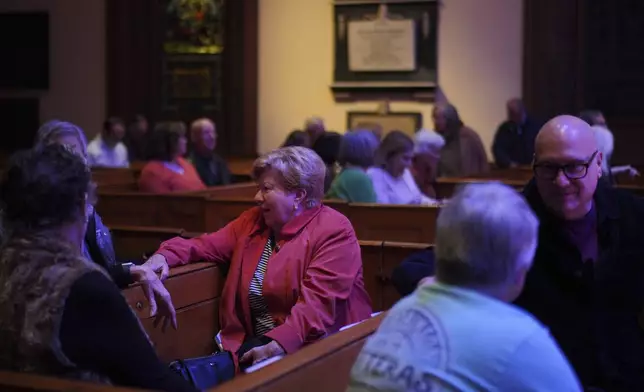 People gather at St. James Episcopal Church in Lancaster, Pa., for a "Contemplative Citizenship" service, on Tuesday, Oct. 15, 2024. (AP Photo/Jessie Wardarski)