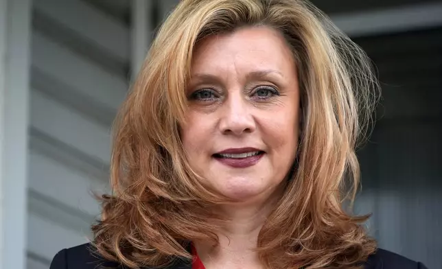 FILE - Democratic candidate for Pennsylvania state treasurer Erin McClelland poses for a photo on the porch of her home in Natrona Heights, Pa, Sept. 18, 2024. (AP Photo/Gene J. Puskar, File)