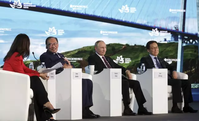 FILE - From left: TV presenter for "Russia 24" Alexandra Suvorova, Malaysia's Prime Minister Anwar Ibrahim, Russian President Vladimir Putin, and China's Vice President Han Zheng attend the Eastern Economic Forum in Vladivostok, Russia, on Sept. 5, 2024. (Vyacheslav Prokofyev, Sputnik, Kremlin Pool Photo via AP, File)