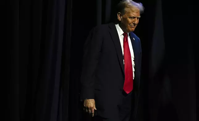 Republican presidential nominee former President Donald Trump arrives to speak at a meeting of the Detroit Economic Club, Thursday, Oct. 10, 2024, in Detroit. (AP Photo/Julia Demaree Nikhinson)