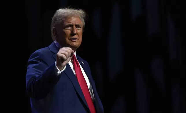 Republican presidential nominee former President Donald Trump departs a meeting of the Detroit Economic Club, Thursday, Oct. 10, 2024, in Detroit. (AP Photo/Julia Demaree Nikhinson)