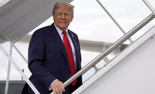 Republican presidential nominee former President Donald Trump boards his plane at West Palm Beach International Airport, Saturday, Oct. 5, 2024, in West Palm Beach, Fla., as he travels to a campaign rally in Butler, Pa. (AP Photo/Evan Vucci)