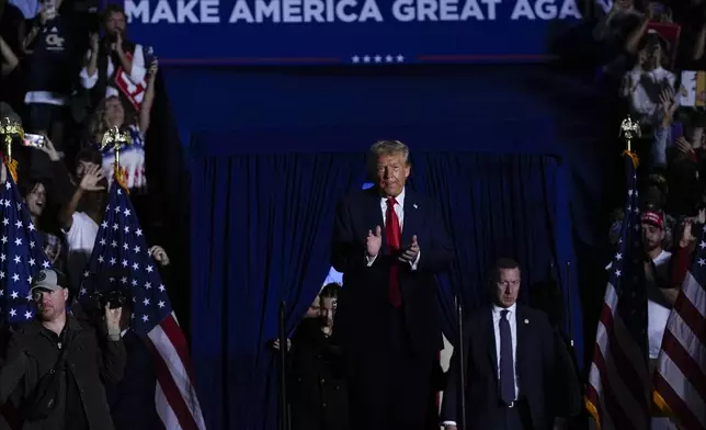 Republican presidential nominee former President Donald Trump arrives at a campaign rally at McCamish Pavilion Monday, Oct. 28, 2024, in Atlanta, Ga. (AP Photo/Julia Demaree Nikhinson)