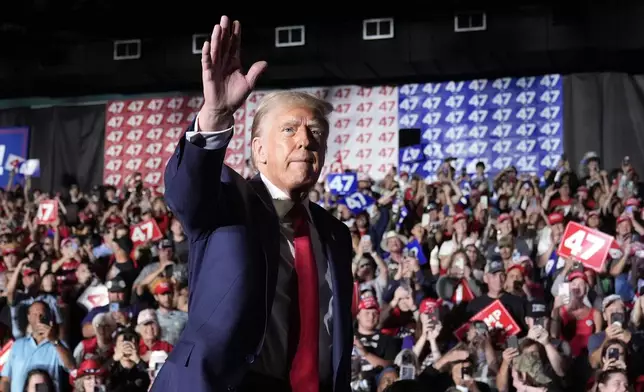 Republican presidential nominee former President Donald Trump waves at a campaign rally at Greensboro Coliseum, Tuesday, Oct. 22, 2024, in Greensboro, N.C. (AP Photo/Alex Brandon)