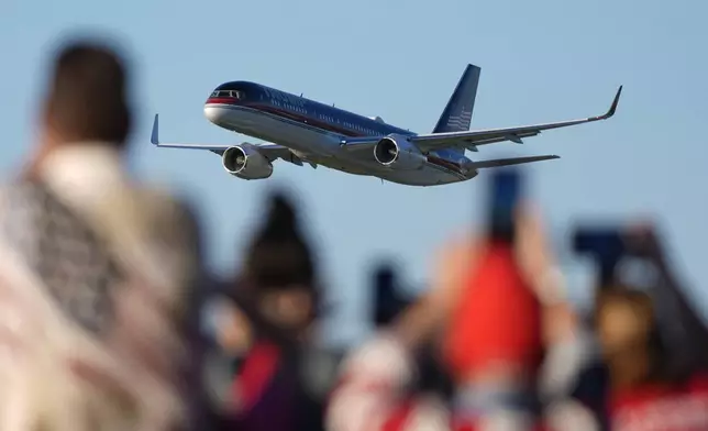 The plane carrying Republican presidential nominee former President Donald Trump arrives for a campaign rally at Arnold Palmer Regional Airport, Saturday, Oct. 19, 2024, in Latrobe, Pa. (AP Photo/Evan Vucci)