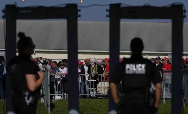 Supporters wait to go through security as they arrive before Republican presidential nominee former President Donald Trump speaks at a campaign rally at the Butler Farm Show, Saturday, Oct. 5, 2024, in Butler, Pa. (AP Photo/Julia Demaree Nikhinson)