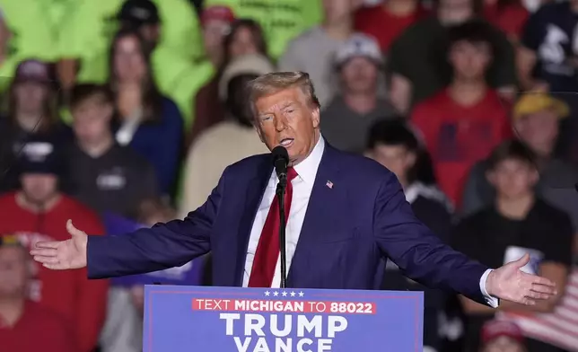 Republican presidential nominee former President Donald Trump speaks at a campaign event at the Ryder Center at Saginaw Valley State University, Thursday, Oct. 3, 2024, in University Center, Mich. (AP Photo/Carlos Osorio)