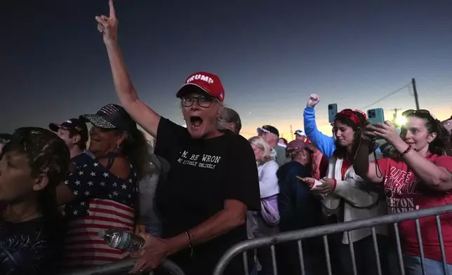 Supporters cheer after a campaign rally with Republican presidential nominee former President Donald Trump at the Butler Farm Show, Saturday, Oct. 5, 2024, in Butler, Pa. (AP Photo/Julia Demaree Nikhinson)