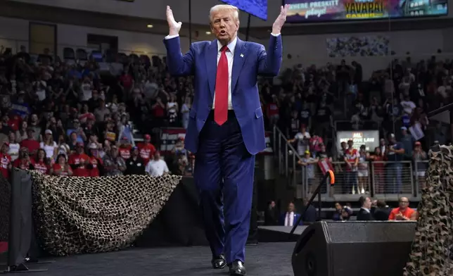 Republican presidential nominee former President Donald Trump gestures at a campaign rally at the Findlay Toyota Arena Sunday, Oct. 13, 2024, in Prescott Valley, Ariz. (AP Photo/Evan Vucci)