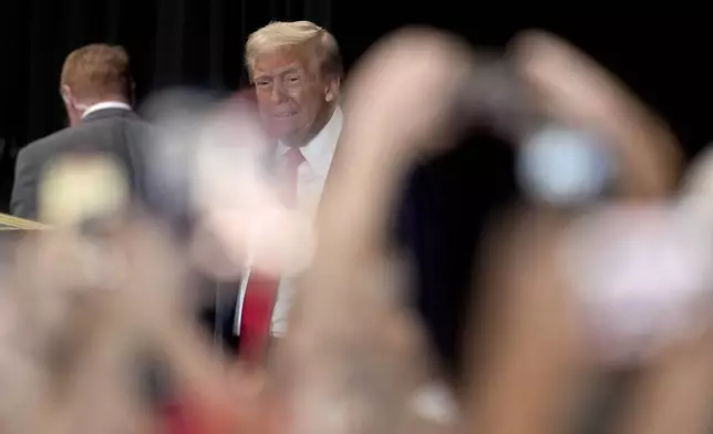 Republican presidential nominee former President Donald Trump arrives to speak at a campaign event at Beauty Society, Saturday, Oct. 12, 2024, in North Las Vegas, Nev. (AP Photo/John Locher)