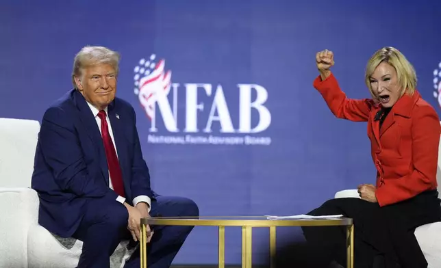 Republican presidential nominee former President Donald Trump speaks with Pastor Paula White during the National Faith Summit at Worship With Wonders Church, Monday, Oct. 28, 2024, in Powder Springs, Ga. (AP Photo/Brynn Anderson)