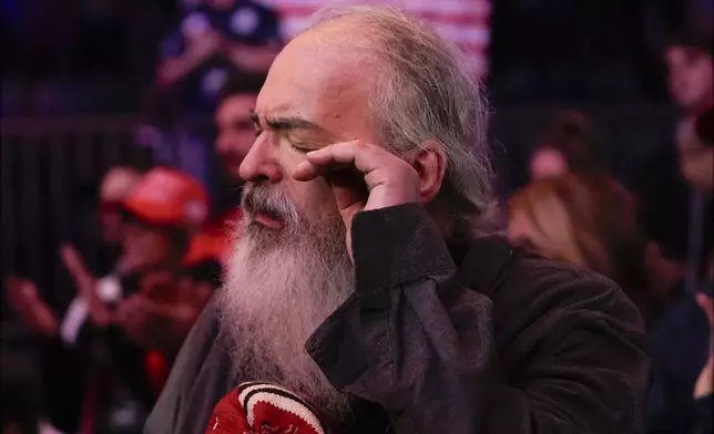 A supporter wipes away a tear during the National Anthem before Republican presidential nominee former President Donald Trump speaks at a campaign rally at Madison Square Garden, Sunday, Oct. 27, 2024, in New York. (AP Photo/Alex Brandon)