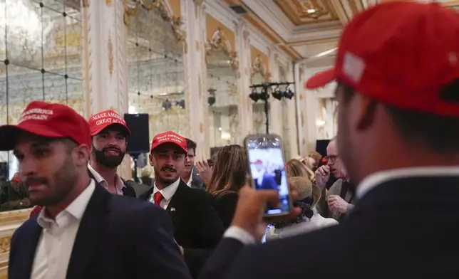 Supporters arrive before Republican presidential nominee former President Donald Trump speaks during a news conference at his Mar-a-Lago estate, Tuesday, Oct. 29, 2024, in Palm Beach, Fla. (AP Photo/Julia Demaree Nikhinson)