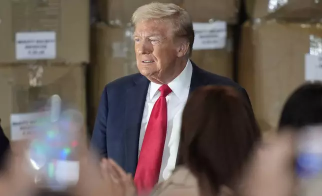 Republican presidential nominee former President Donald Trump arrives to speak at a campaign event at Beauty Society, Saturday, Oct. 12, 2024, in North Las Vegas, Nev. (AP Photo/John Locher)