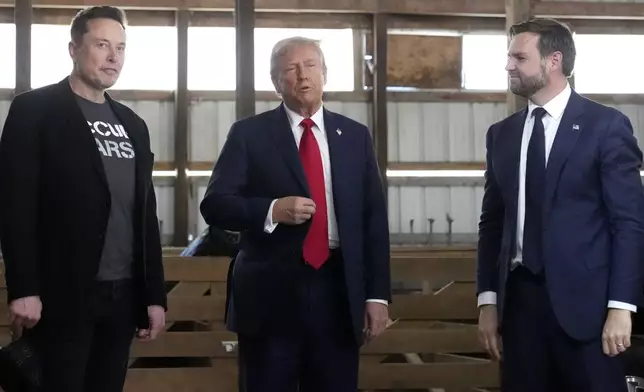 Tesla and SpaceX CEO Elon Musk, from left, Republican presidential nominee former President Donald Trump and Republican vice presidential nominee Sen. JD Vance, R-Ohio, attend a campaign event at the Butler Farm Show, Saturday, Oct. 5, 2024, in Butler, Pa. (AP Photo/Alex Brandon)