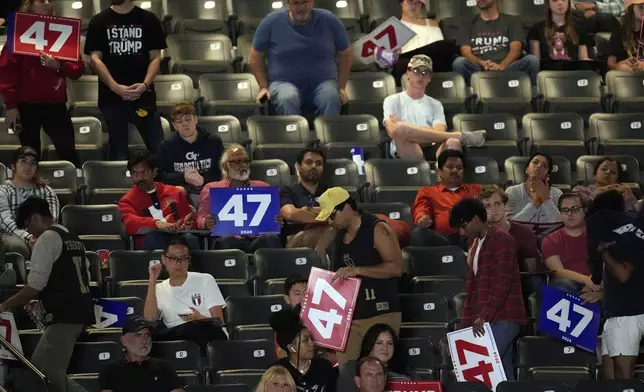 Supporters begin to leave as Republican presidential nominee former President Donald Trump speaks at a campaign rally at McCamish Pavilion Monday, Oct. 28, 2024, in Atlanta. (AP Photo/Mike Stewart)