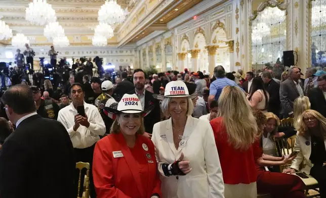 Supporters arrive before Republican presidential nominee former President Donald Trump speaks during a news conference at his Mar-a-Lago estate, Tuesday, Oct. 29, 2024, in Palm Beach, Fla. (AP Photo/Julia Demaree Nikhinson)