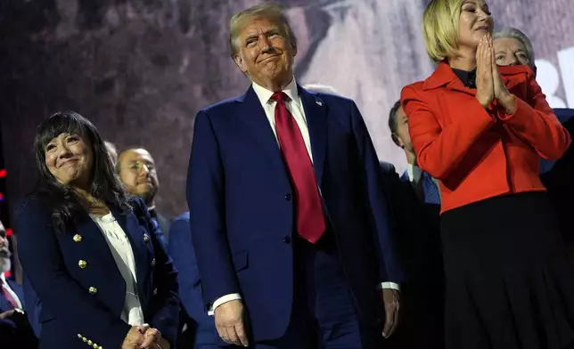 Republican presidential nominee former President Donald Trump stands with Pastor Paula White during the National Faith Summit at Worship With Wonders Church, Monday, Oct. 28, 2024, in Powder Springs, Ga. (AP Photo/Julia Demaree Nikhinson)