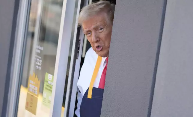 Republican presidential nominee former President Donald Trump speaks from a drive-thru window during a campaign stop at a McDonald's, Sunday, Oct. 20, 2024, in Feasterville-Trevose, Pa. (AP Photo/Evan Vucci)