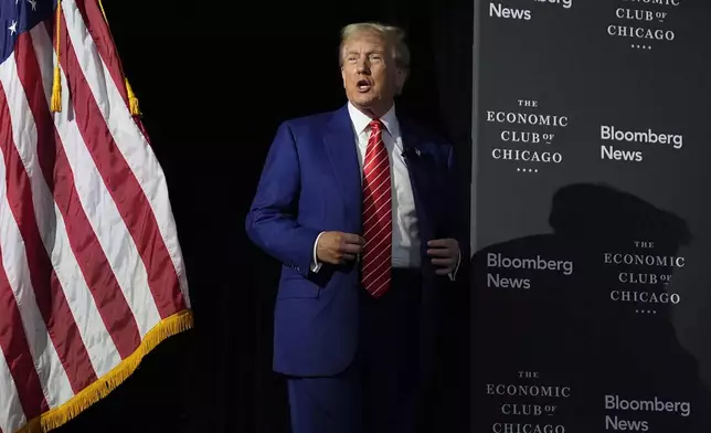 Republican presidential nominee former President Donald Trump arrives for an interview with Bloomberg News Editor-in-Chief John Micklethwait during an event with the Economic Club of Chicago, Tuesday, Oct. 15, 2024, in Chicago. (AP Photo/Evan Vucci)