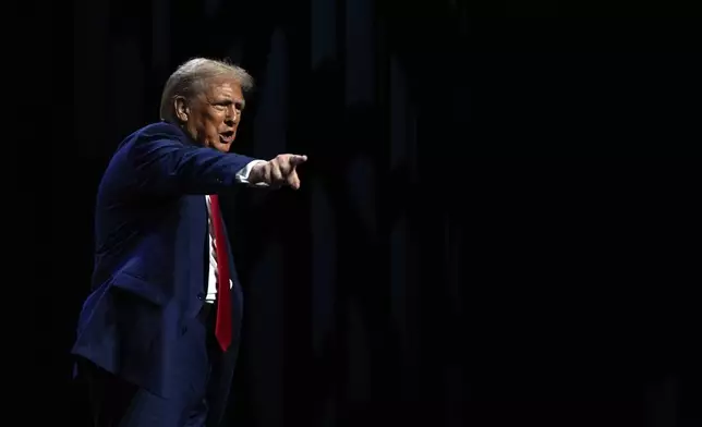 Republican presidential nominee former President Donald Trump departs a meeting of the Detroit Economic Club, Thursday, Oct. 10, 2024, in Detroit. (AP Photo/Julia Demaree Nikhinson)