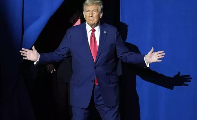 Republican presidential nominee former President Donald Trump arrives for a town hall at Lancaster County Convention Center, Sunday, Oct. 20, 2024, in Lancaster, Pa. (AP Photo/Evan Vucci)