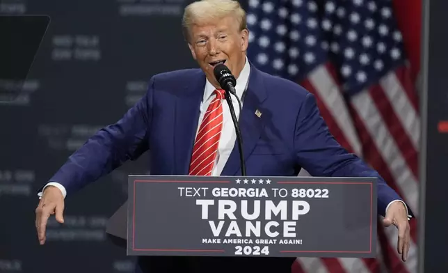 Republican presidential nominee former President Donald Trump speaks at a campaign event at the Cobb Energy Performing Arts Centre, Tuesday, Oct. 15, 2024, in Atlanta. (AP Photo/John Bazemore)