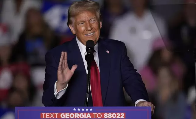 Republican presidential nominee former President Donald Trump speaks at a campaign rally at McCamish Pavilion Monday, Oct. 28, 2024, in Atlanta. (AP Photo/Mike Stewart)