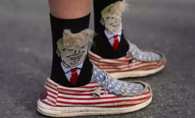 An person wears Donald Trump-themed socks before a campaign rally for Republican presidential nominee former President Donald Trump at Riverfront Sports, Wednesday, Oct. 9, 2024, in Scranton, Pa. (AP Photo/Julia Demaree Nikhinson)