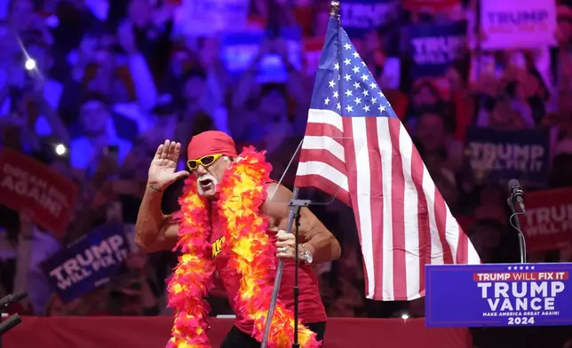 Hulk Hogan stands on stage before Republican presidential nominee former President Donald Trump at a campaign rally at Madison Square Garden, Sunday, Oct. 27, 2024, in New York. (AP Photo/Evan Vucci)