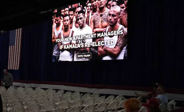 A video is displayed before Republican presidential nominee former President Donald Trump speaks at a campaign town hall at the Greater Philadelphia Expo Center &amp; Fairgrounds, Monday, Oct. 14, 2024, in Oaks, Pa. (AP Photo/Alex Brandon)