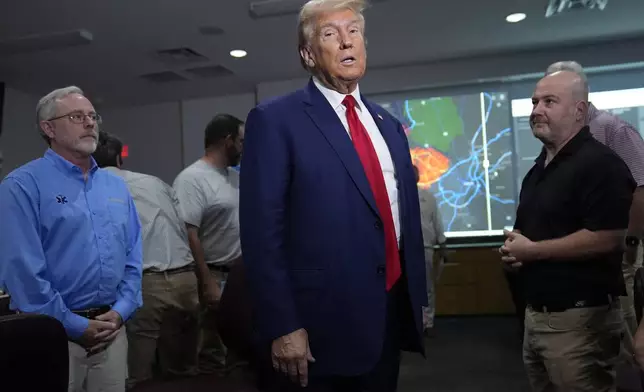 Republican presidential nominee former President Donald Trump arrives for a briefing at the Columbia County Emergency Management Agency as he visits areas impacted by Hurricane Helene, Friday, Oct. 4, 2024, in Evans, Ga. (AP Photo/Evan Vucci)