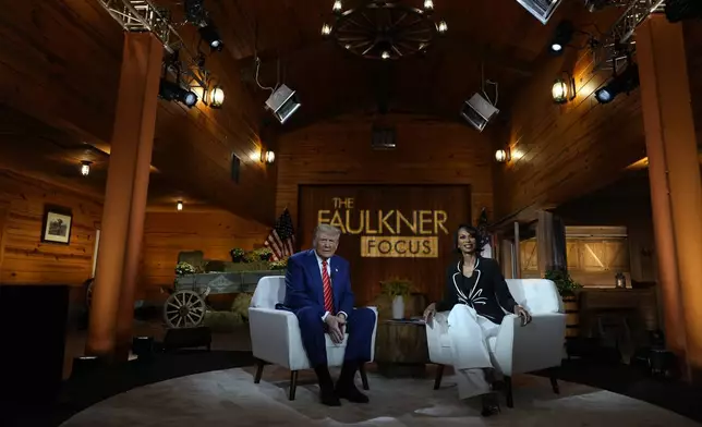 Republican presidential nominee former President Donald Trump speaks during a break in a Fox News town hall with Harris Faulkner at The Reid Barn, Tuesday, Oct. 15, 2024, in Cumming, Ga. (AP Photo/Julia Demaree Nikhinson)