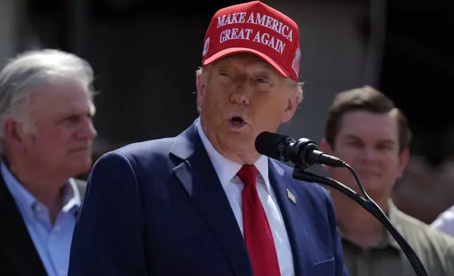 Republican presidential nominee former President Donald Trump speaks outside the Chez What furniture store as he visits Valdosta, Ga., a town impacted by Hurricane Helene, Monday, Sept. 30, 2024. (AP Photo/Evan Vucci)