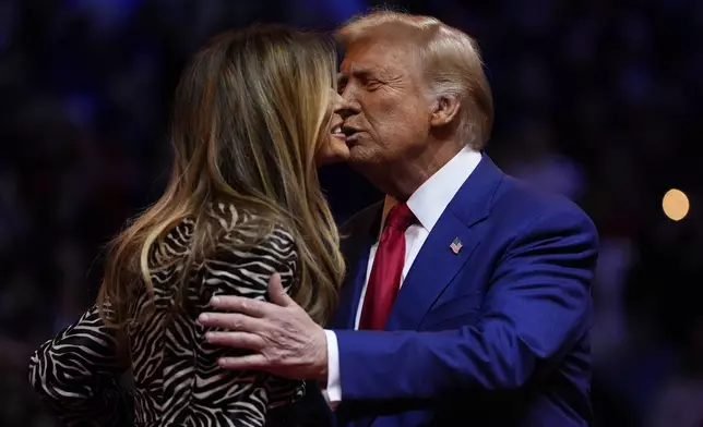 Republican presidential nominee former President Donald Trump greets former first lady Melania Trump during a campaign rally at Madison Square Garden, Sunday, Oct. 27, 2024, in New York. (AP Photo/Julia Demaree Nikhinson)