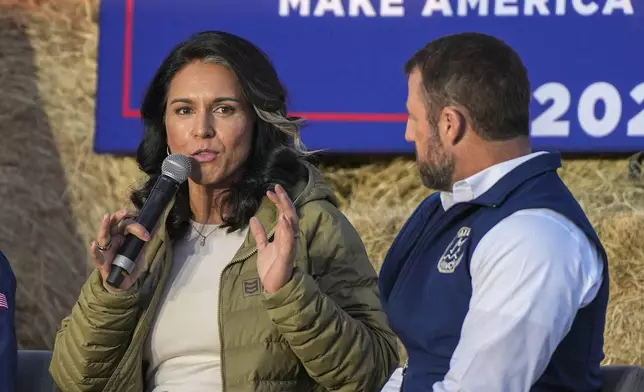 Former Democratic Rep. Tulsi Gabbard speaks during a campaign event in support of Republican presidential candidate former President Donald Trump, Friday, Oct. 18, 2024, in Red Springs, N.C. as Sen. Markwayne Mullin, R-Okla., listens (AP Photo/David Yeazell)