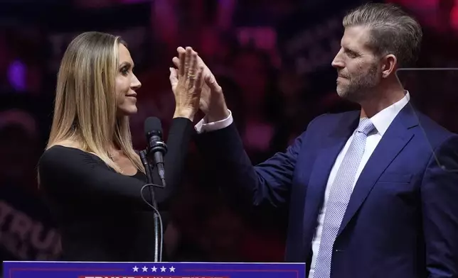 Eric Trump and his wife Lara, speak before Republican presidential nominee former President Donald Trump at a campaign rally at Madison Square Garden, Sunday, Oct. 27, 2024, in New York. (AP Photo/Evan Vucci)