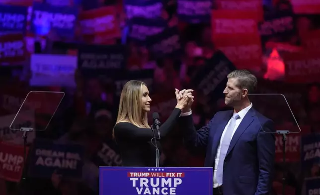 Eric Trump and his wife Lara, speak before Republican presidential nominee former President Donald Trump at a campaign rally at Madison Square Garden, Sunday, Oct. 27, 2024, in New York. (AP Photo/Evan Vucci)