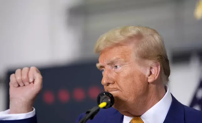 Republican presidential nominee former President Donald Trump gestures at the conclusion of a news conference at Austin-Bergstrom International Airport, Friday, Oct. 25, 2024, in Austin, Texas. (AP Photo/Alex Brandon)