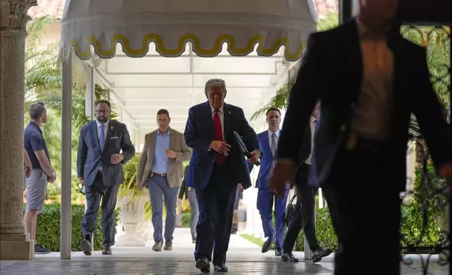 Republican presidential nominee former President Donald Trump arrives for a news conference at his Mar-a-Lago estate, Tuesday, Oct. 29, 2024, in Palm Beach, Fla. (AP Photo/Julia Demaree Nikhinson)