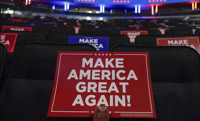 Signs are placed in seats before Republican presidential nominee former President Donald Trump speaks at a campaign rally at Madison Square Garden, Sunday, Oct. 27, 2024, in New York. (AP Photo/Julia Demaree Nikhinson)