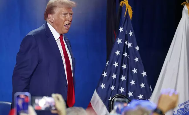 Republican presidential nominee former President Donald Trump leaves the stage after speaking at a town hall event in Fayetteville, N.C., Friday, Oct. 4, 2024. (AP Photo/Karl B DeBlaker)