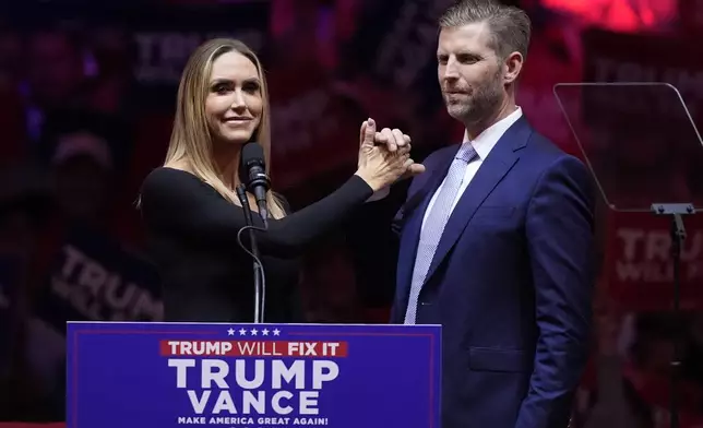 Eric Trump and his wife Lara, speak before Republican presidential nominee former President Donald Trump at a campaign rally at Madison Square Garden, Sunday, Oct. 27, 2024, in New York. (AP Photo/Evan Vucci)