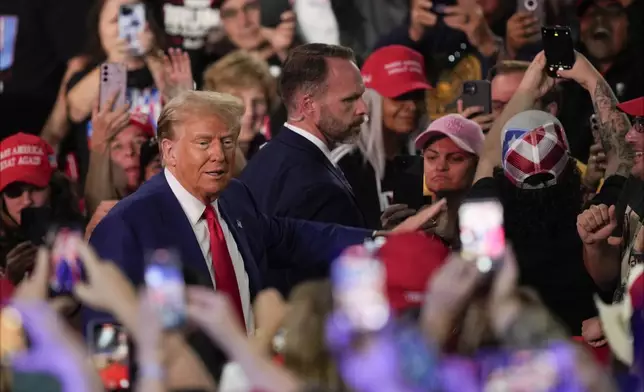 Republican presidential nominee former President Donald Trump arrives at a campaign town hall at the Greater Philadelphia Expo Center &amp; Fairgrounds, Monday, Oct. 14, 2024, in Oaks, Pa. (AP Photo/Matt Rourke)