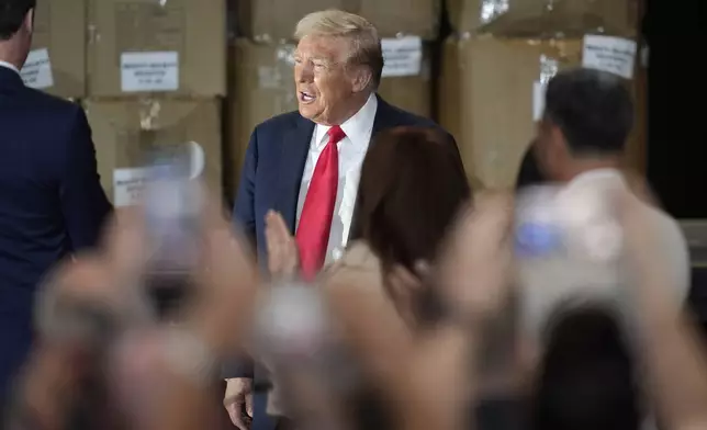 Republican presidential nominee former President Donald Trump arrives to speak at a campaign event at Beauty Society, Saturday, Oct. 12, 2024, in North Las Vegas, Nev. (AP Photo/John Locher)