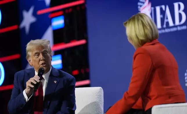 Republican presidential nominee former President Donald Trump speaks with Pastor Paula White during the National Faith Summit at Worship With Wonders Church, Monday, Oct. 28, 2024, in Powder Springs, Ga. (AP Photo/Julia Demaree Nikhinson)