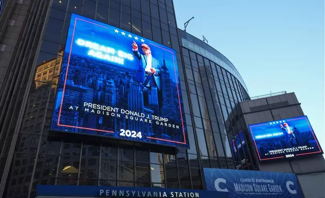 Video boards outside Madison Square Garden display information about the campaign rally for Republican presidential nominee former President Donald Trump Sunday, Oct. 27, 2024, in New York. (AP Photo/Alex Brandon)