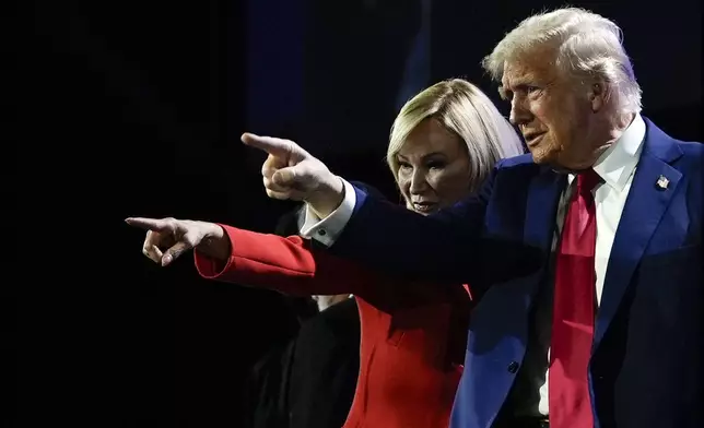 Republican presidential nominee former President Donald Trump stands with Pastor Paula White during the National Faith Summit at Worship With Wonders Church, Monday, Oct. 28, 2024, in Powder Springs, Ga. (AP Photo/Julia Demaree Nikhinson)