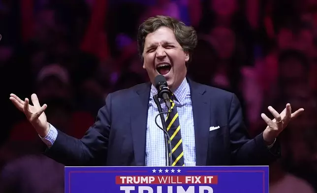 Tucker Carlson speaks before Republican presidential nominee former President Donald Trump at a campaign rally at Madison Square Garden, Sunday, Oct. 27, 2024, in New York. (AP Photo/Evan Vucci)