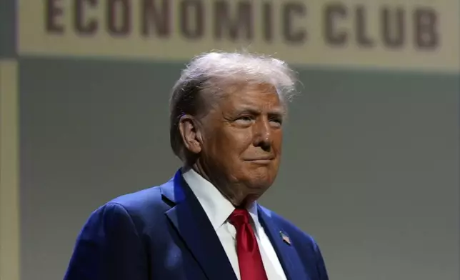 Republican presidential nominee former President Donald Trump arrives to speak at a meeting of the Detroit Economic Club, Thursday, Oct. 10, 2024, in Detroit. (AP Photo/Julia Demaree Nikhinson)